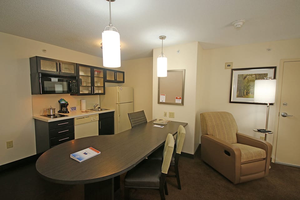 Desk, laptop workspace, blackout drapes, iron/ironing board
