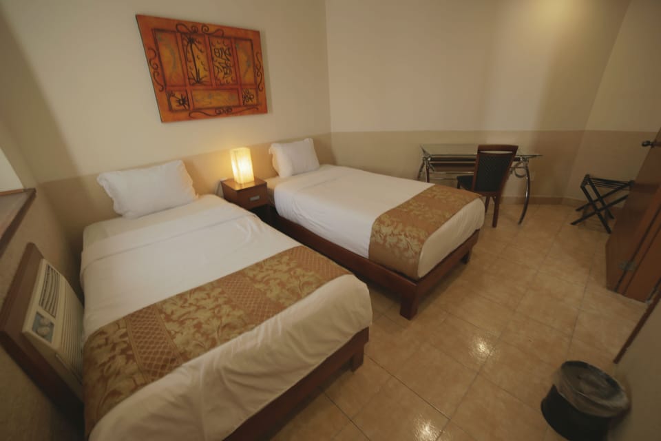 Desk, laptop workspace, WiFi (free), bed sheets