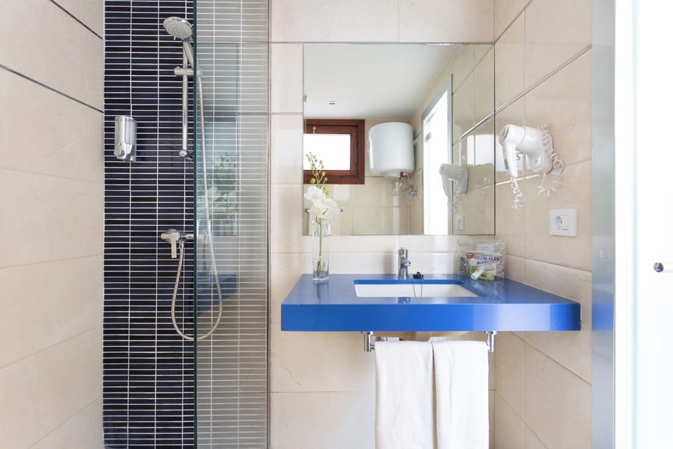 Bathroom | Shower, free toiletries, hair dryer, towels