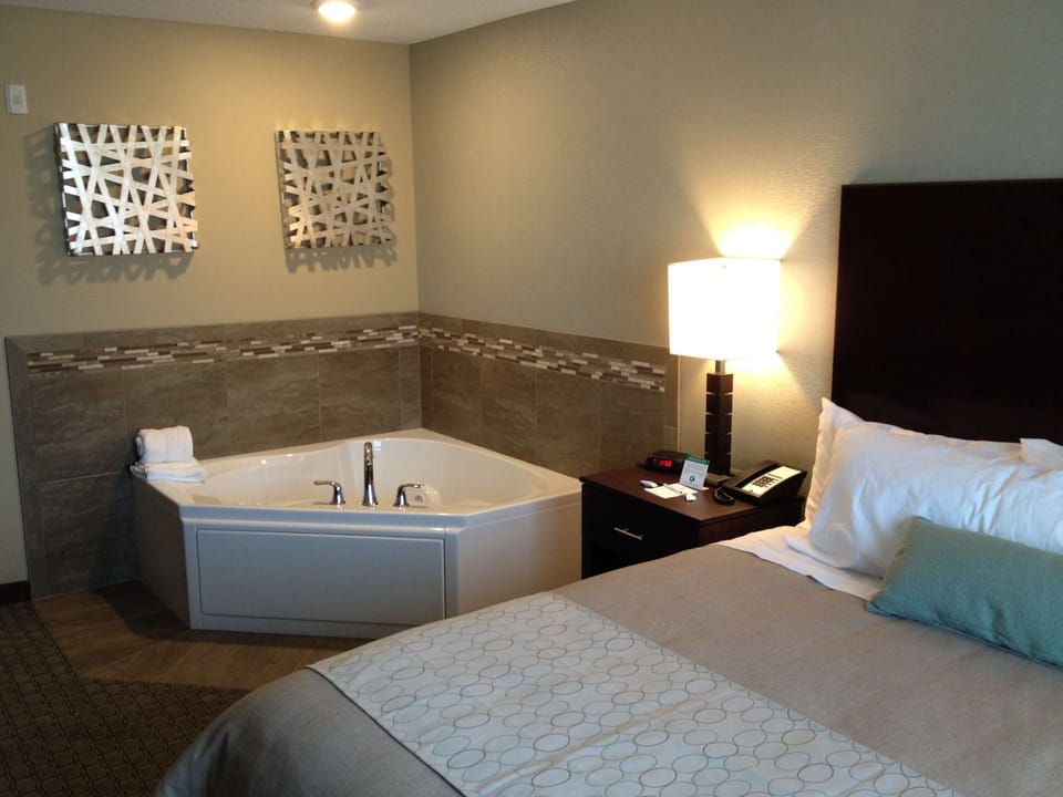 Suite, 1 King Bed | Pool | Indoor pool, pool umbrellas