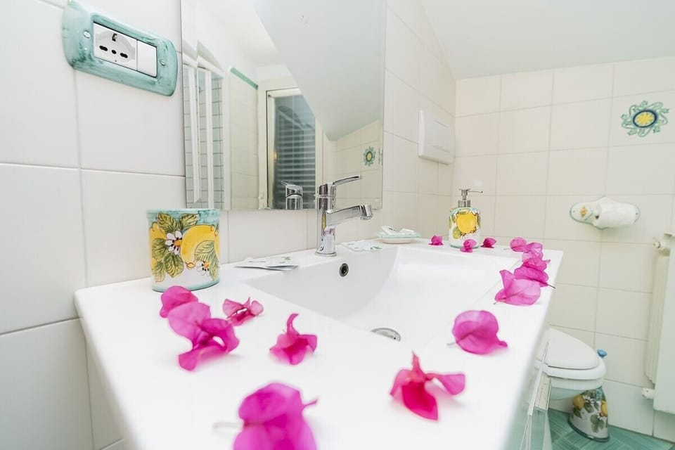Deluxe Quadruple Room, Terrace | Bathroom | Shower, rainfall showerhead, free toiletries, hair dryer