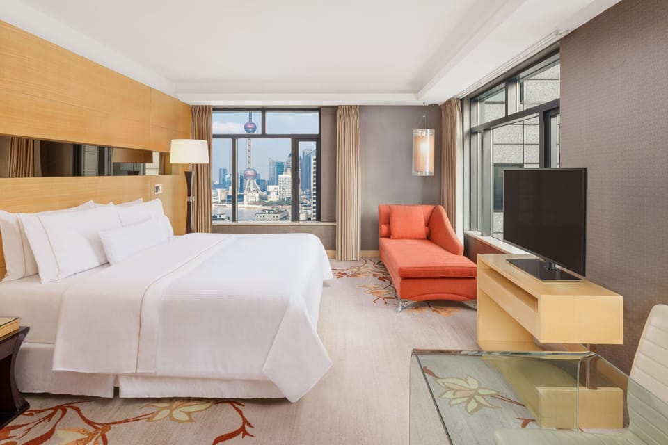 Room, 1 King Bed, Tower | 1 bedroom, down comforters, minibar, in-room safe