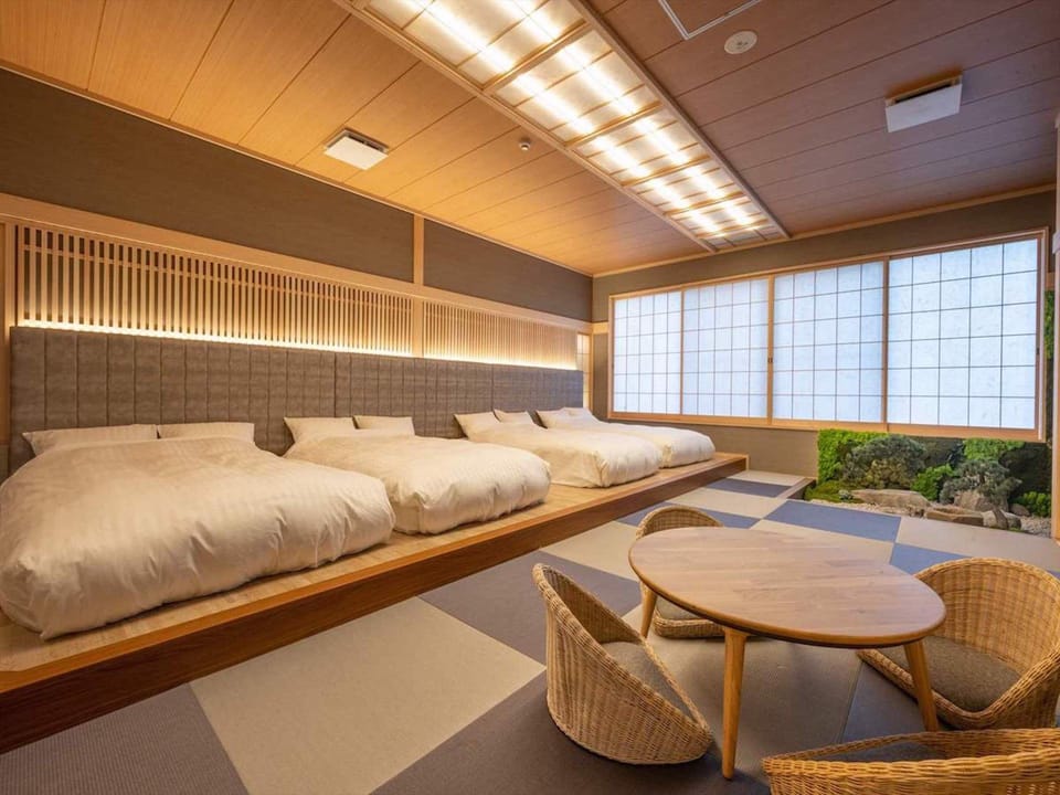 Premium Quadruple Room | Down comforters, memory foam beds, minibar (free items), in-room safe