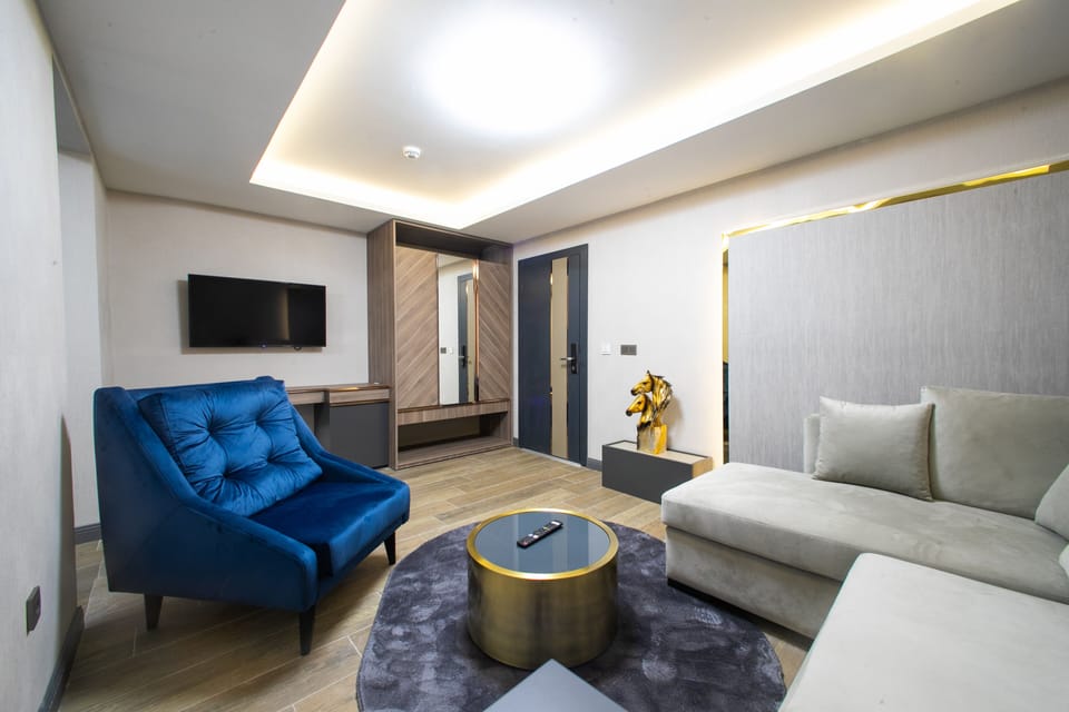 Family Suite | Minibar, blackout drapes, iron/ironing board (on request), WiFi (free)