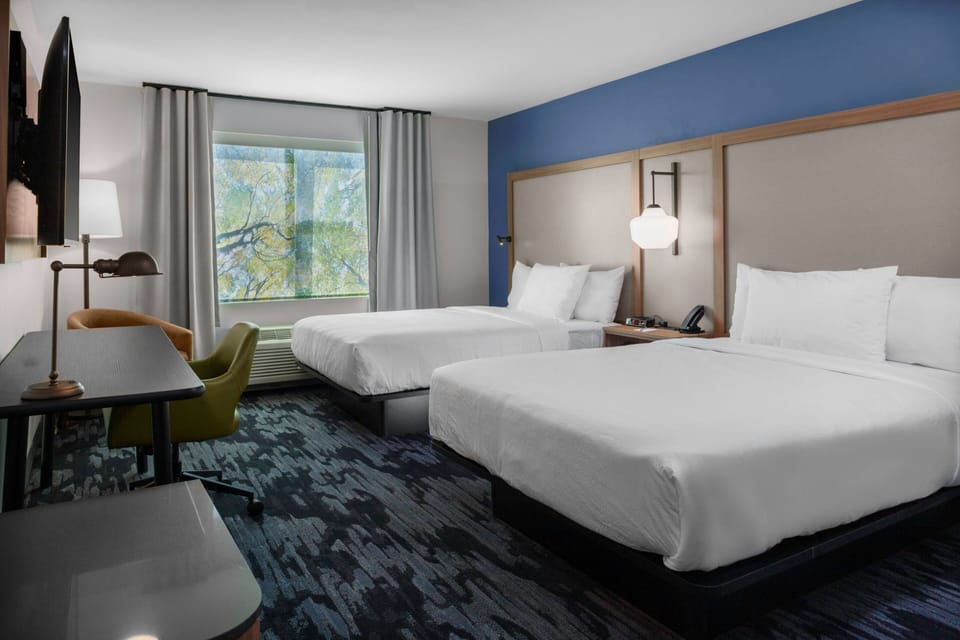 Premium bedding, pillowtop beds, desk, laptop workspace