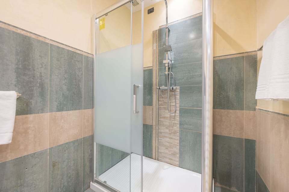 Superior Room (305) | Bathroom | Hair dryer, bidet, towels