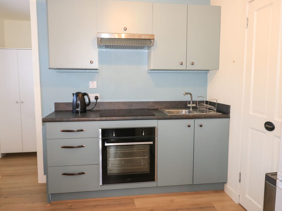 Fridge, electric kettle, toaster, cookware/dishes/utensils