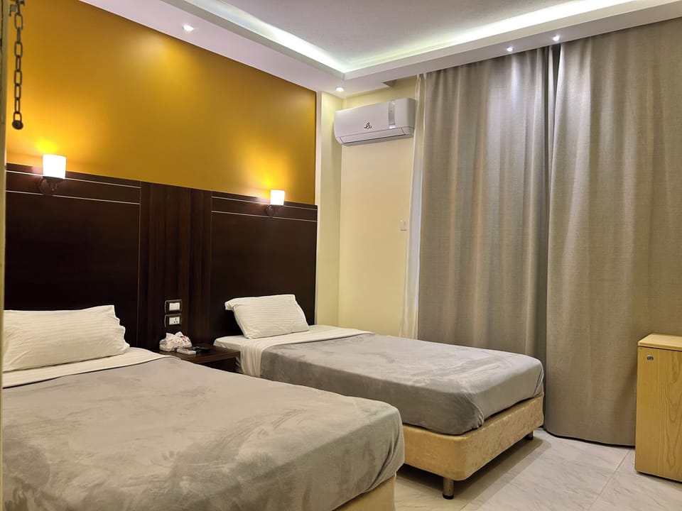Standard Double or Twin Room | Minibar, desk, iron/ironing board (on request), WiFi (free)
