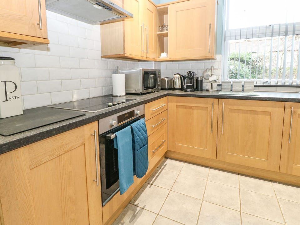 Fridge, electric kettle, cookware/dishes/utensils