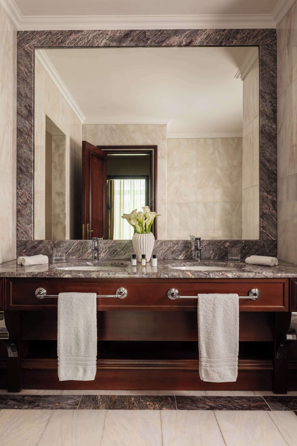 Designer toiletries, hair dryer, slippers, towels
