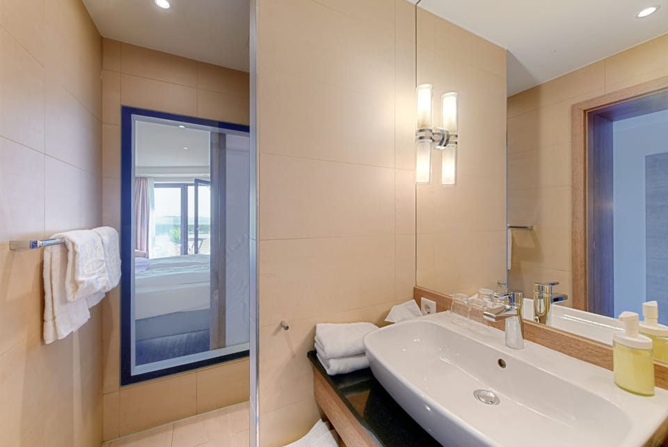 Comfort Double Room (water side) | Bathroom | Shower, hair dryer, towels, soap