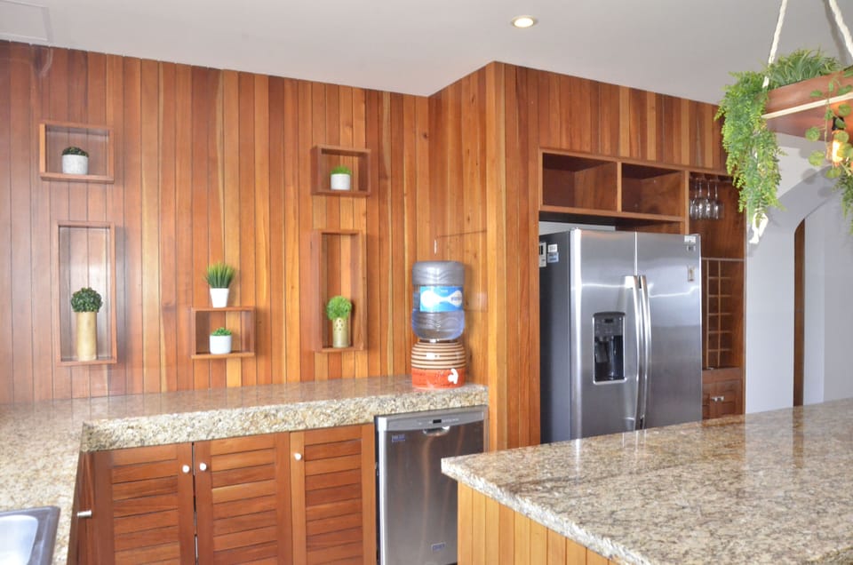Deluxe Apartment | Private kitchen | Coffee/tea maker, dining tables