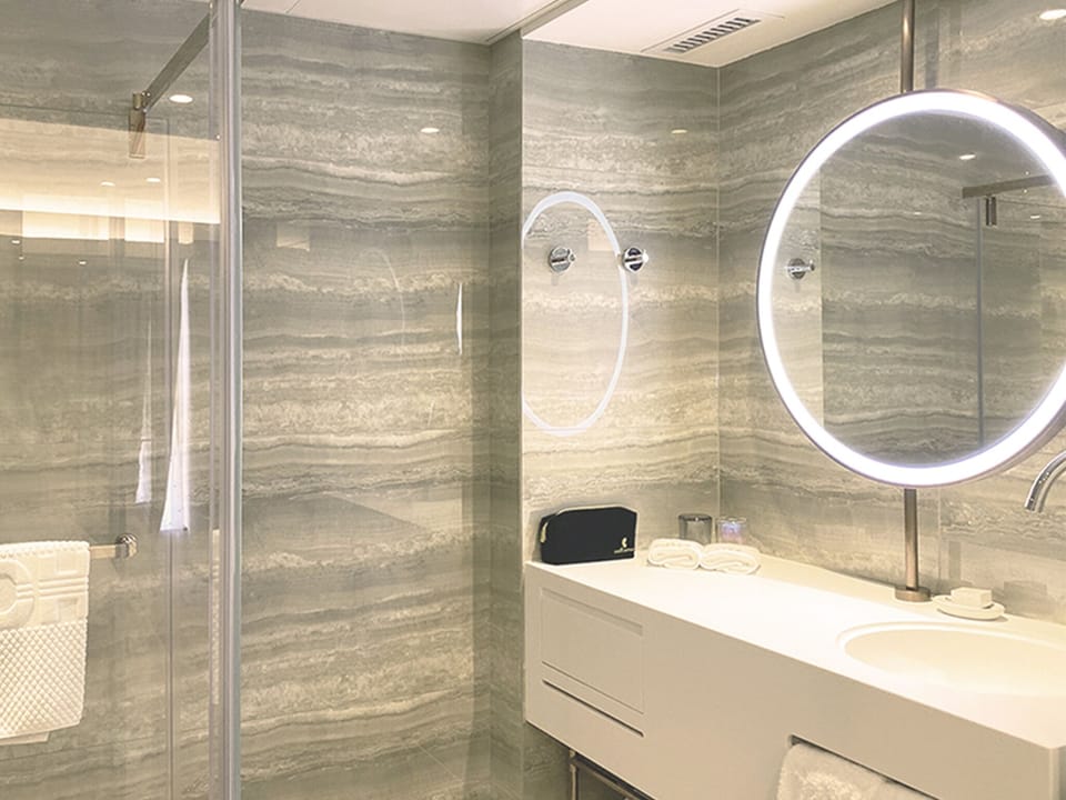 Smart Suite | Bathroom | Shower, rainfall showerhead, hair dryer, slippers