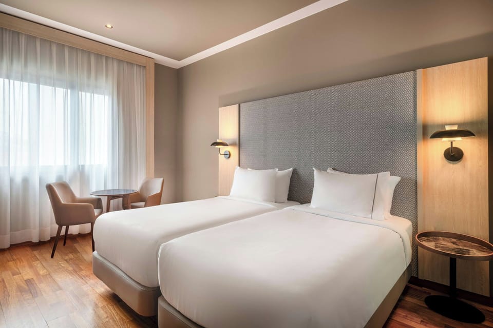 Standard Room, 2 Twin Beds | Minibar, in-room safe, desk, laptop workspace
