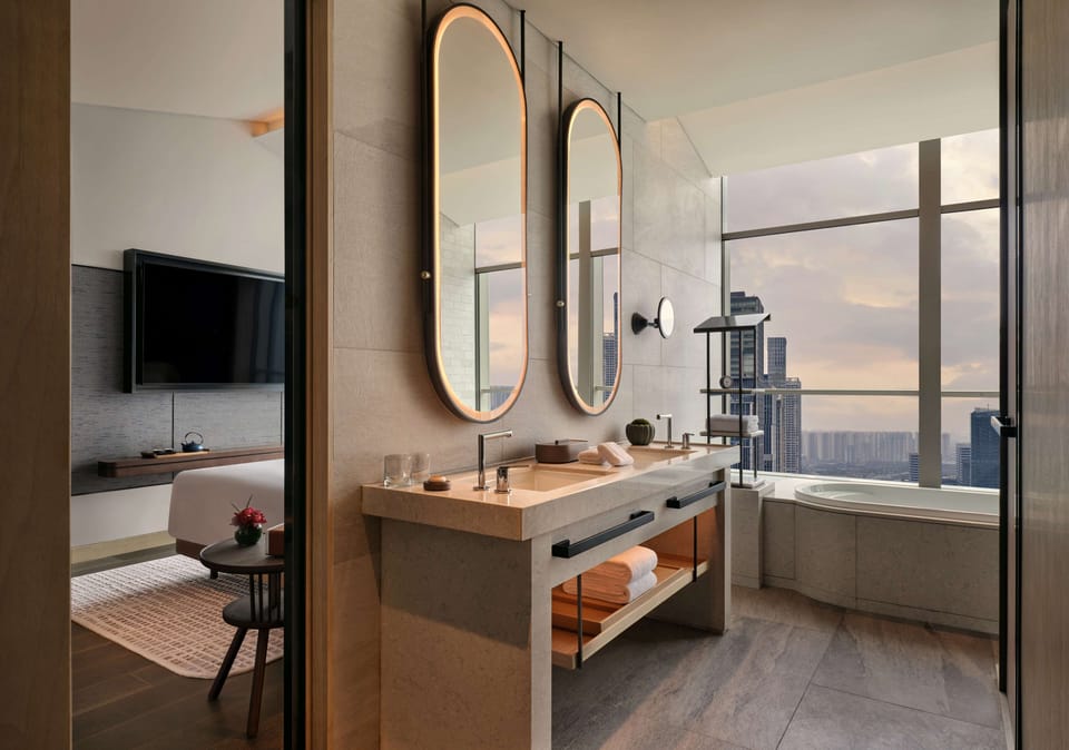 Andaz Deluxe Suite with River View | Bathroom | Designer toiletries, hair dryer, bathrobes, slippers