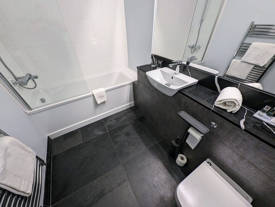 Twin Room | Bathroom | Designer toiletries, hair dryer, towels, soap