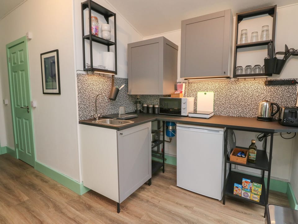 Fridge, electric kettle, toaster, cookware/dishes/utensils