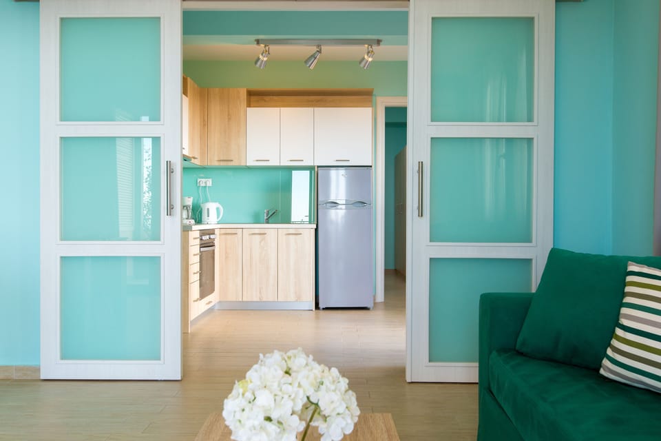 Suite, 1 Bedroom, Sea View | Living area | 32-inch flat-screen TV with satellite channels, TV