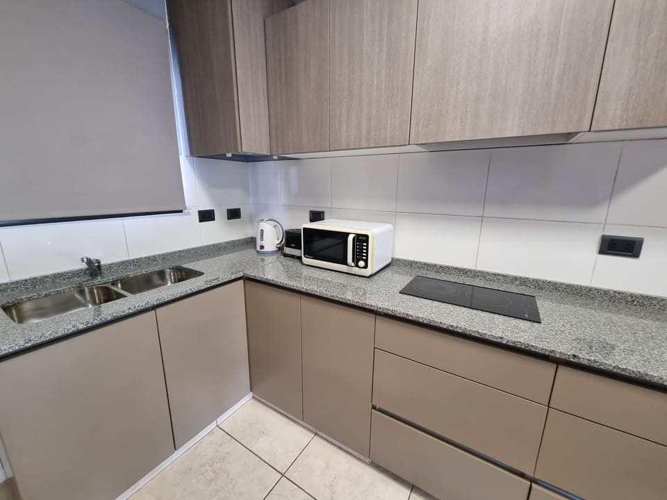 Comfort Apartment, 1 Bedroom | Private kitchen | Mini-fridge, microwave, stovetop, coffee/tea maker