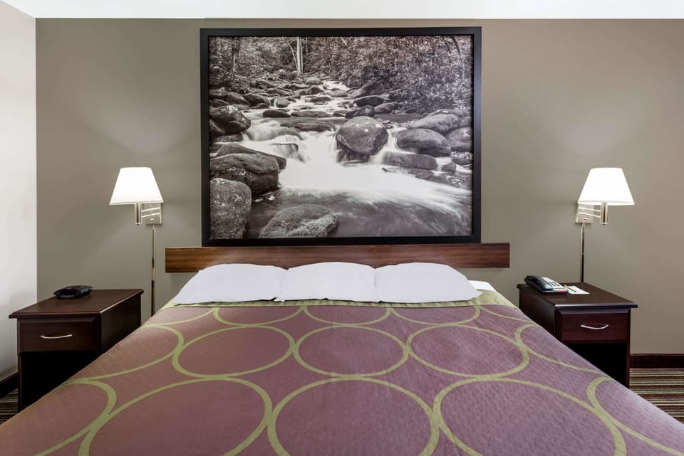 Desk, laptop workspace, blackout drapes, iron/ironing board