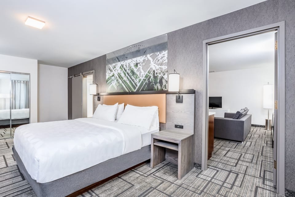 Desk, laptop workspace, blackout drapes, iron/ironing board