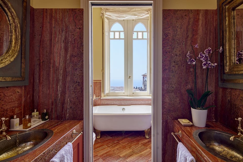 Deluxe Room | Bathroom | Designer toiletries, hair dryer, bathrobes, slippers