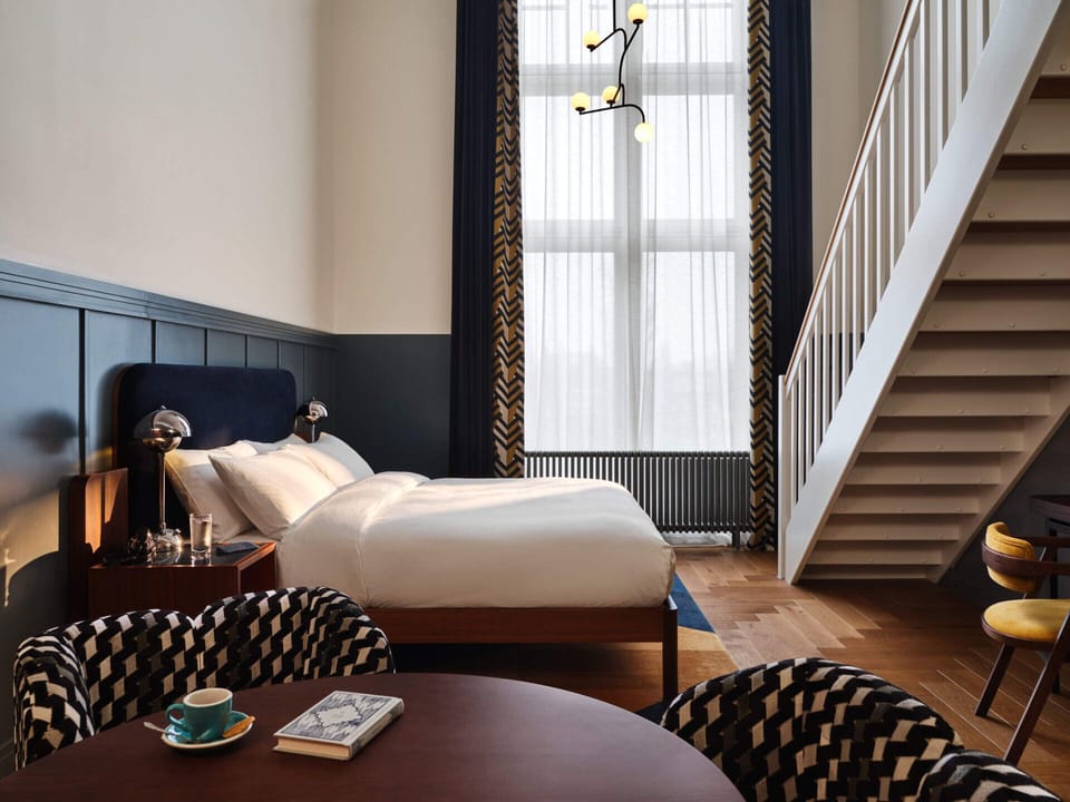 Studio Up | Premium bedding, in-room safe, desk, blackout drapes