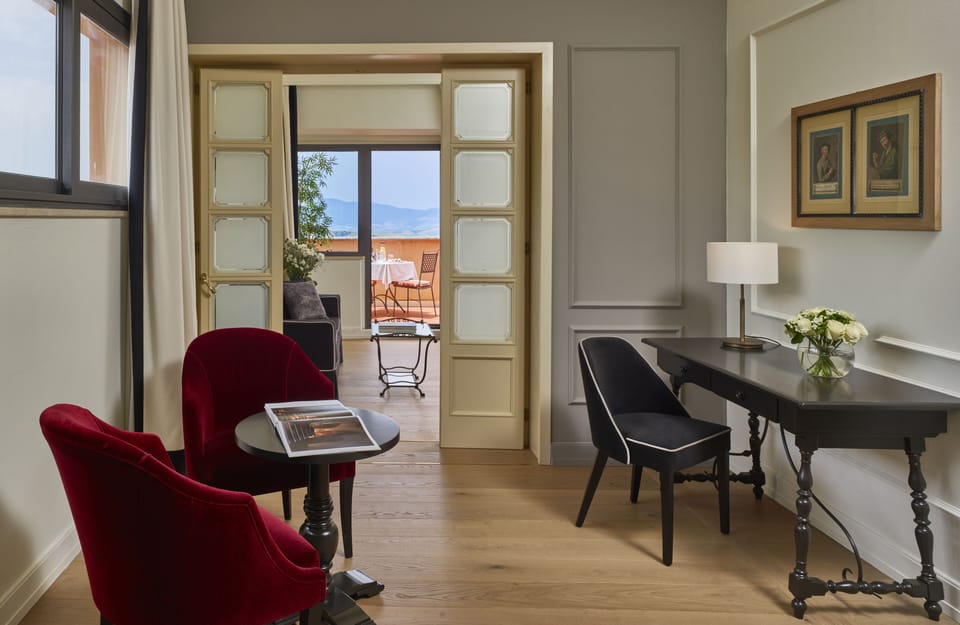 Grand Suite | Living area | 50-inch LCD TV with satellite channels, TV