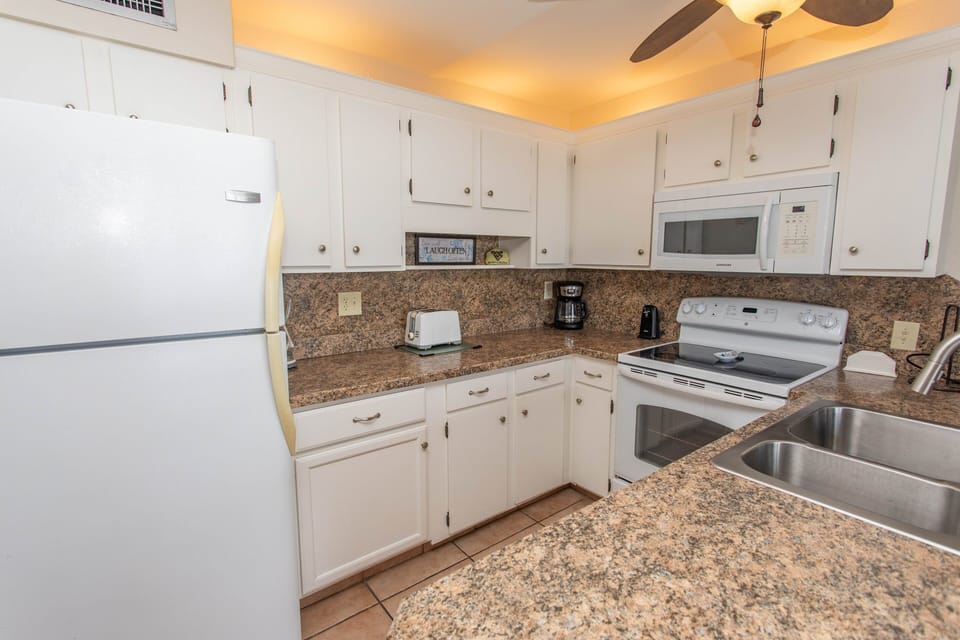 Condo, 2 Bedrooms | Private kitchen | Coffee/tea maker, fridge, oven, toaster