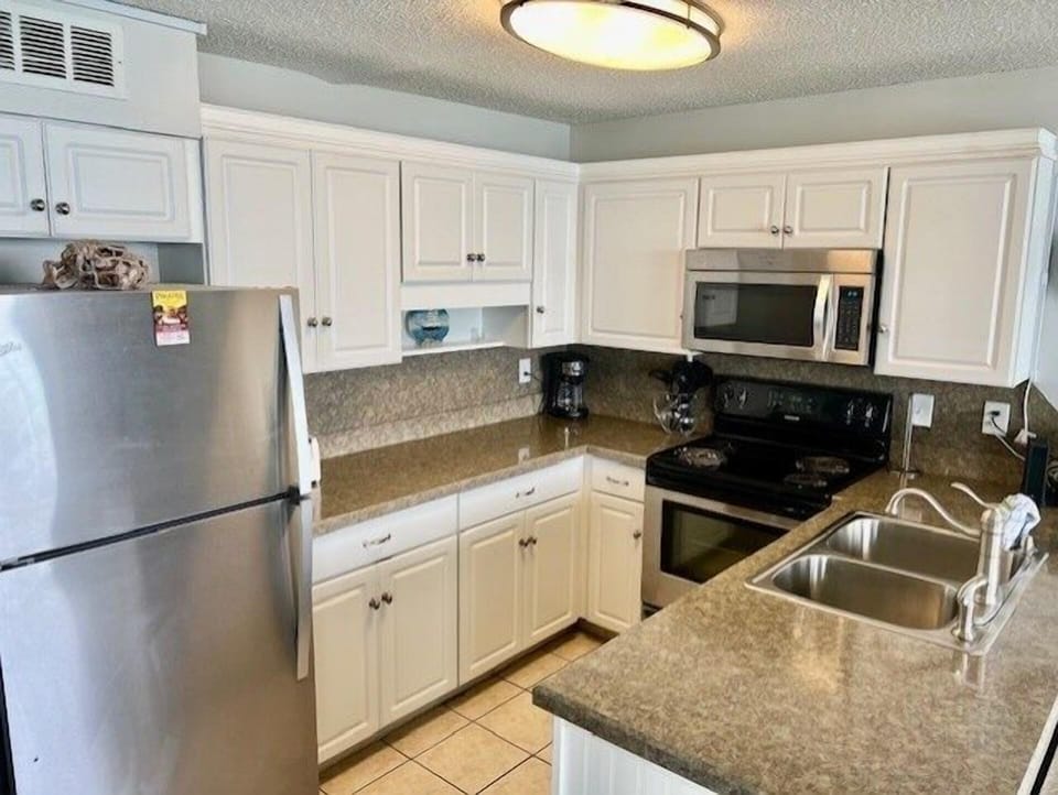 Condo, 2 Bedrooms | Private kitchen | Coffee/tea maker, fridge, oven, toaster