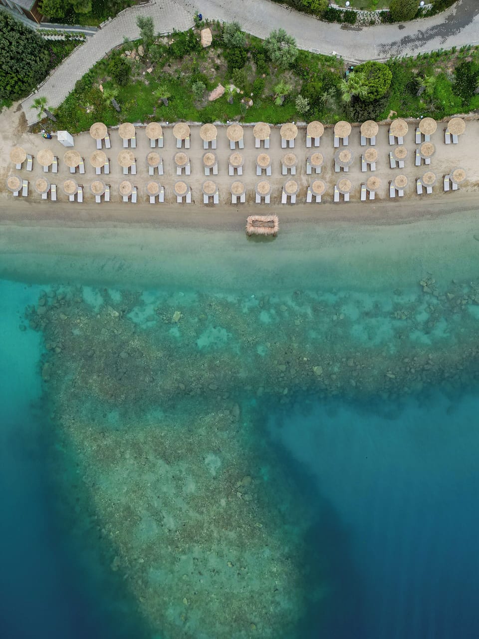 On the beach, sun loungers, beach umbrellas, beach bar