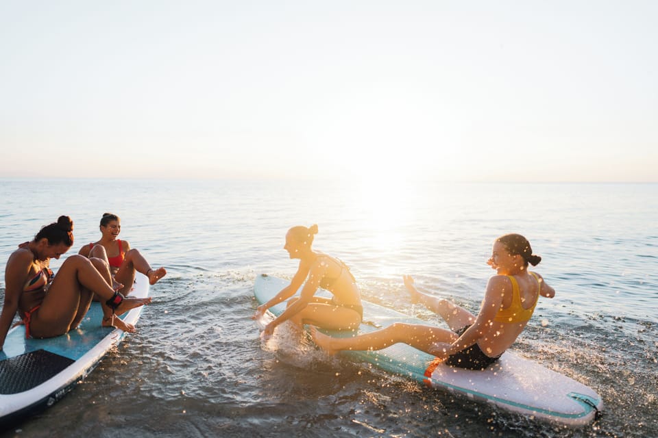 On the beach, white sand, windsurfing, motor boating