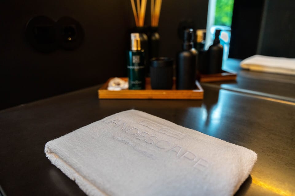 Designer toiletries, hair dryer, bathrobes, slippers