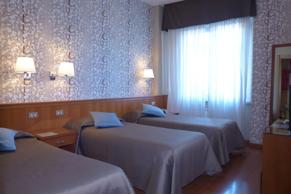 Triple Room | Down comforters, minibar, in-room safe, desk