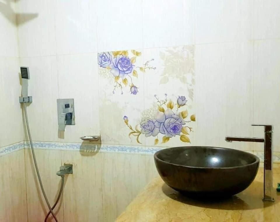 Deluxe Suite | Bathroom | Rainfall showerhead, designer toiletries, towels, soap