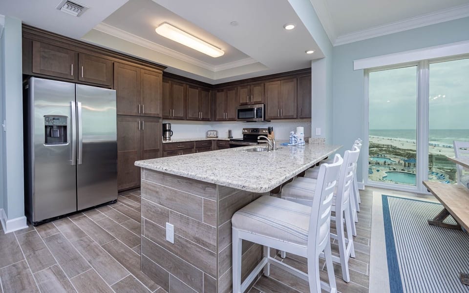 Condo, 4 Bedrooms | Private kitchen | Fridge, oven, coffee/tea maker