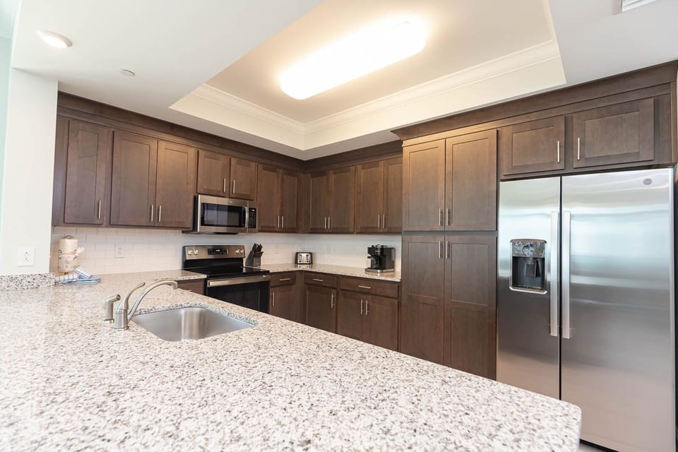 Condo, 4 Bedrooms | Private kitchen | Fridge, oven, coffee/tea maker