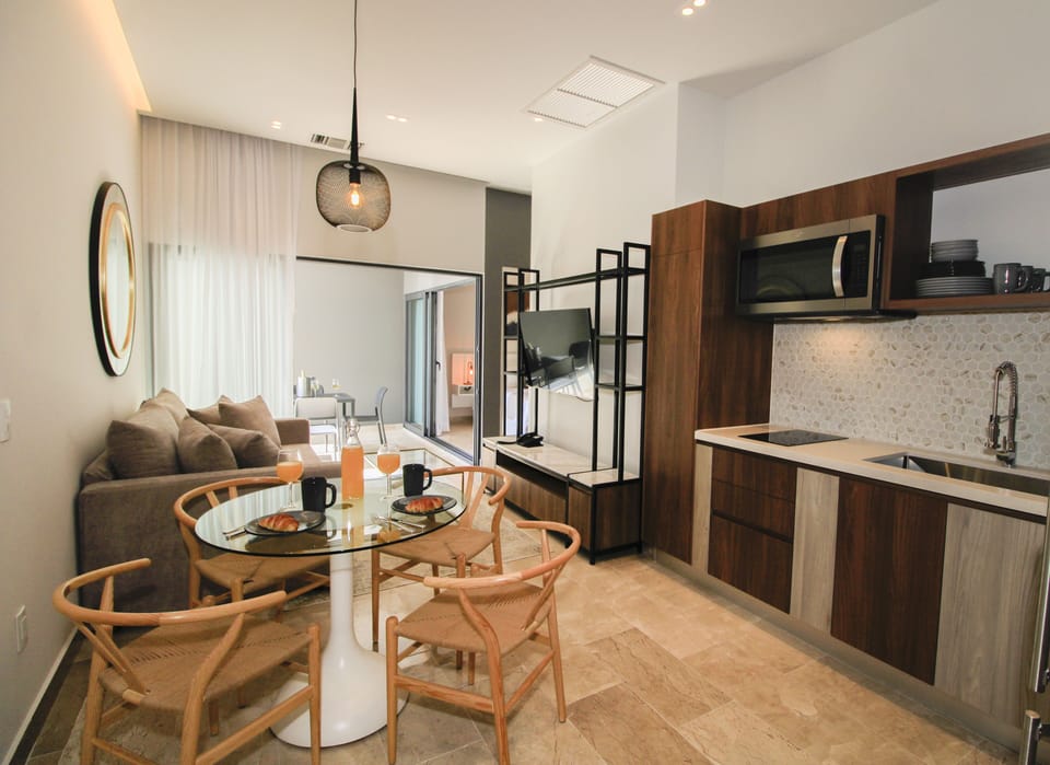 Luxury Suite, 2 Bedrooms, Ocean View | Living area | 42-inch LCD TV with cable channels, TV, Netflix
