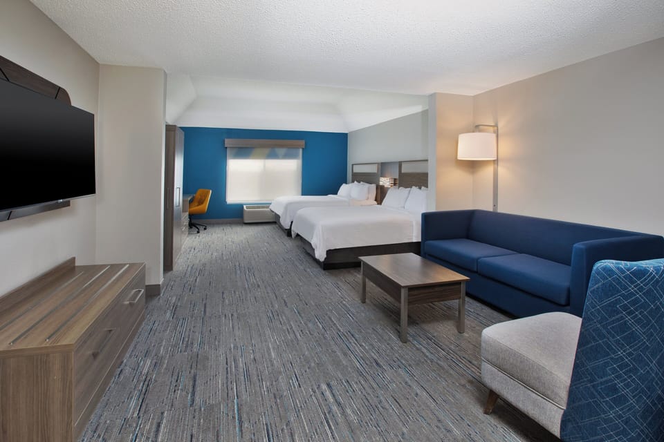 Suite, 2 Queen Beds | Desk, blackout drapes, iron/ironing board, free cribs/infant beds