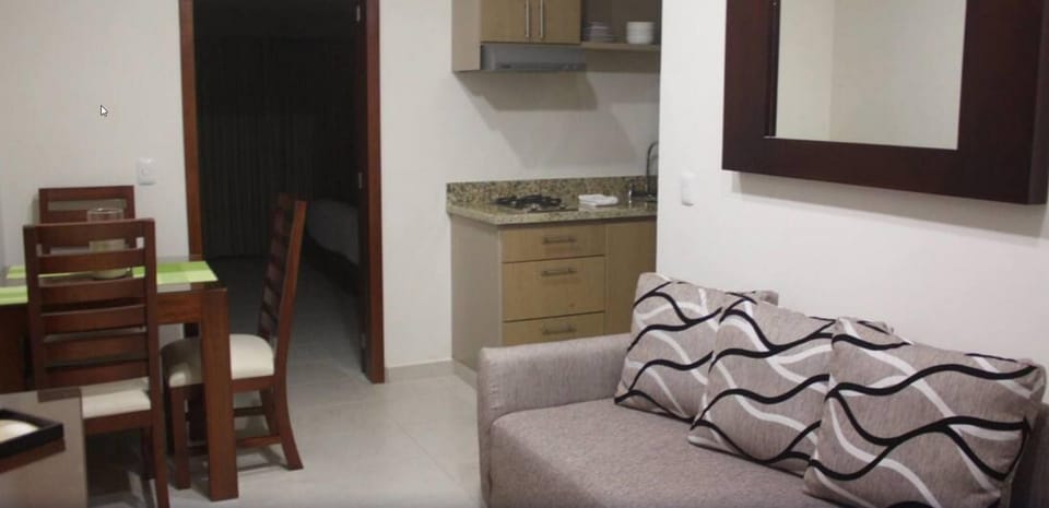 Junior Suite, 1 King Bed | Living room | 32-inch TV with cable channels