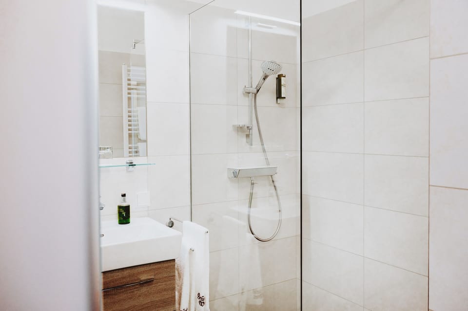 Double Room | Bathroom | Shower, hair dryer, bathrobes, heated floors