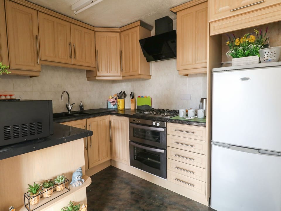 Fridge, electric kettle, toaster, cookware/dishes/utensils