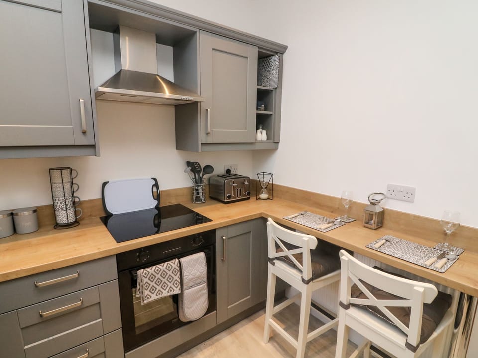 Fridge, electric kettle, toaster, cookware/dishes/utensils