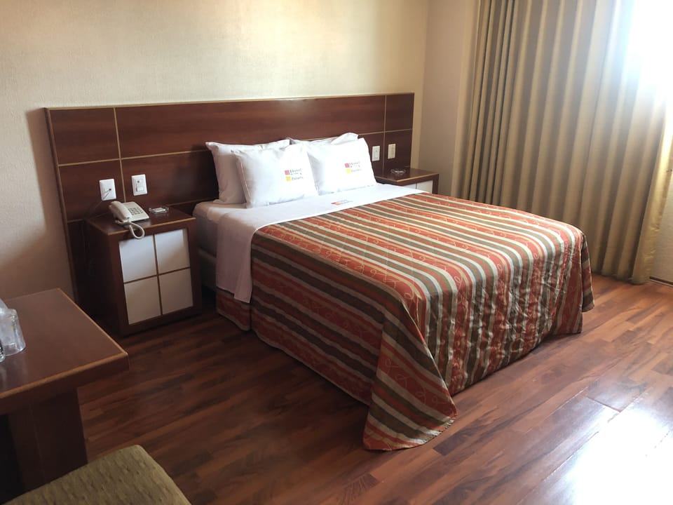 Comfort Room | Premium bedding, in-room safe, desk, iron/ironing board