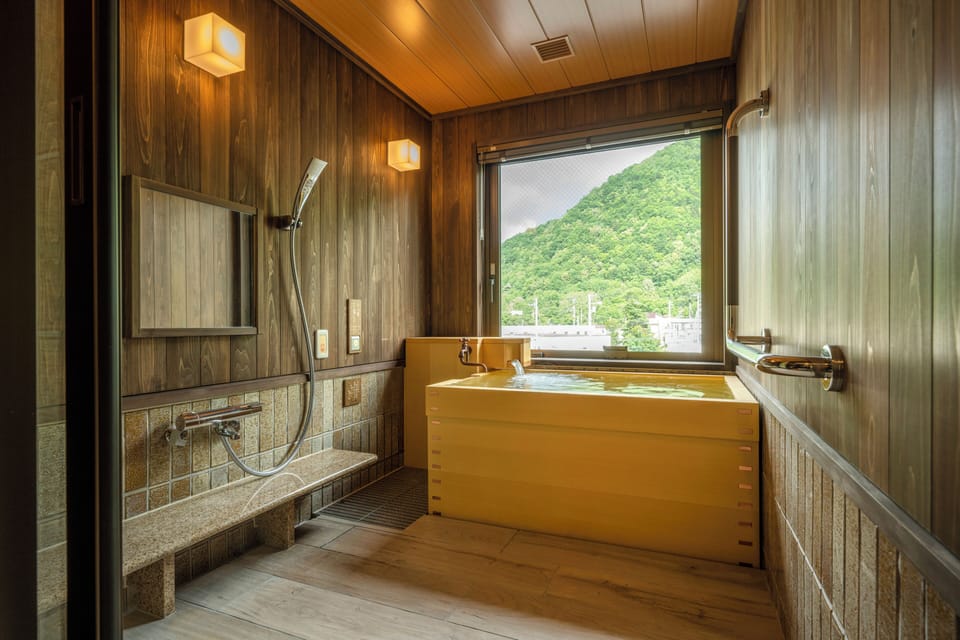 Universal Room 36sq, Non Smoking, 2nd to 3rd floor, with Hot Spring Bath | Bathroom | Combined shower/tub, spring water tub, hair dryer, towels