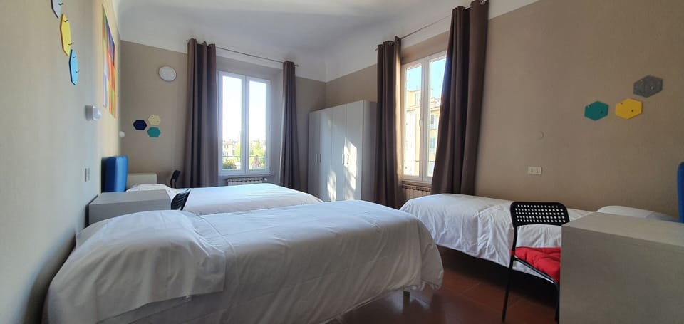 Quadruple Room | Down comforters, desk, laptop workspace, blackout drapes