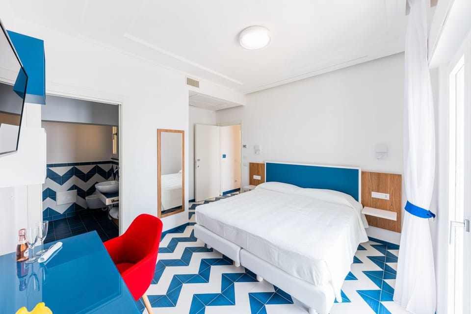 Deluxe Double or Twin Room | Down comforters, minibar, in-room safe, desk