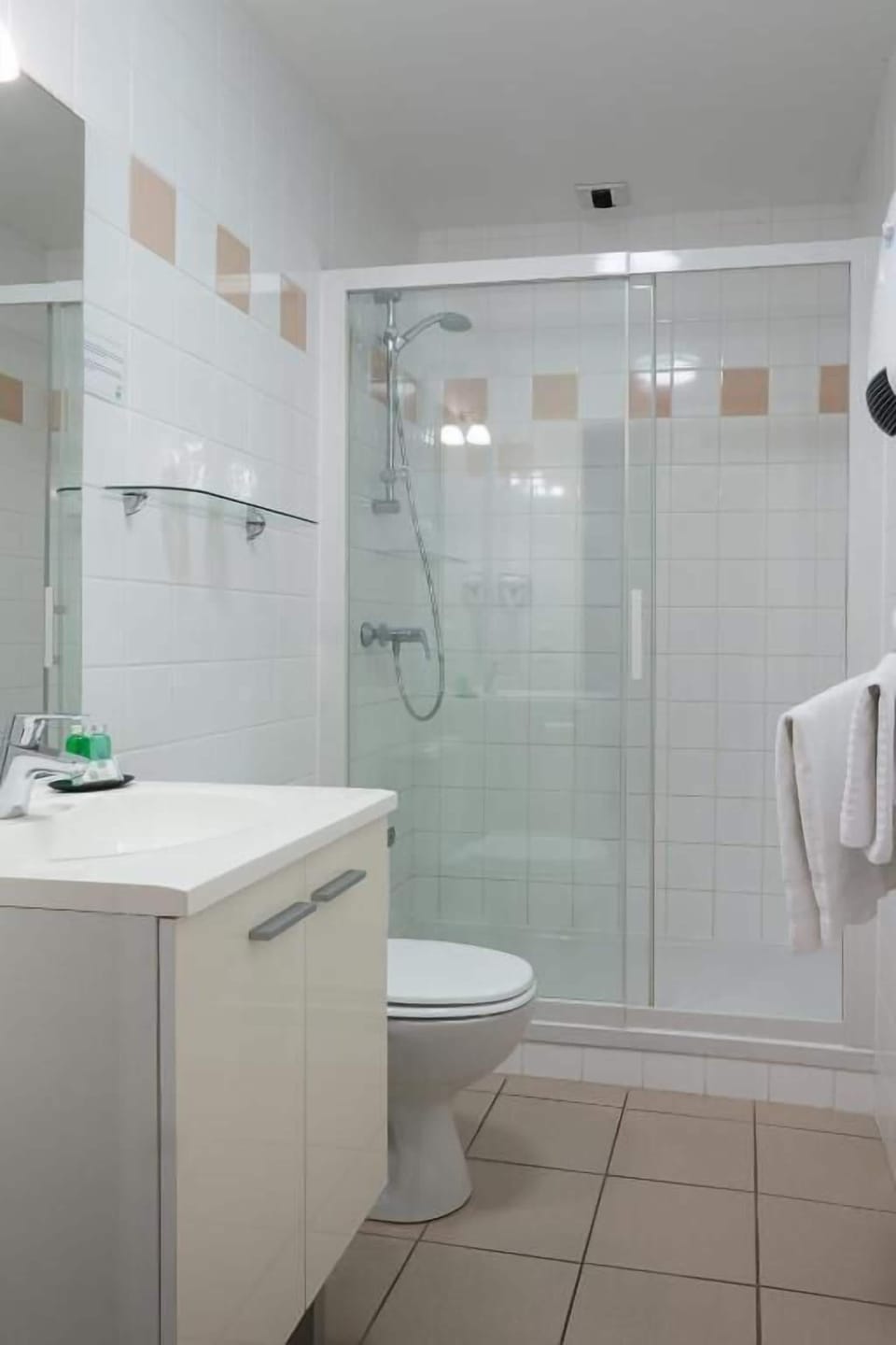 Shower, rainfall showerhead, designer toiletries, hair dryer