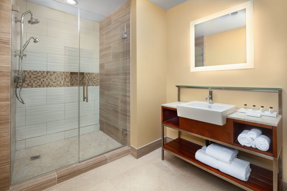 Designer toiletries, hair dryer, bathrobes, towels