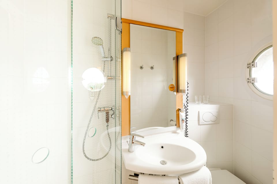 Shower, eco-friendly toiletries, hair dryer, towels